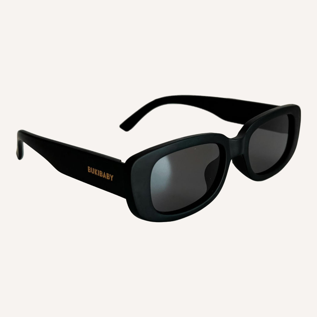 Black polarised kids sunglasses on a white background