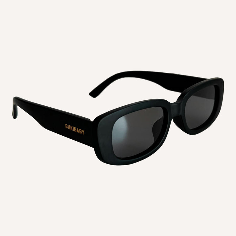 Black polarised kids sunglasses on a white background
